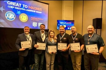 Group of six people holding certificates at a leadership summit